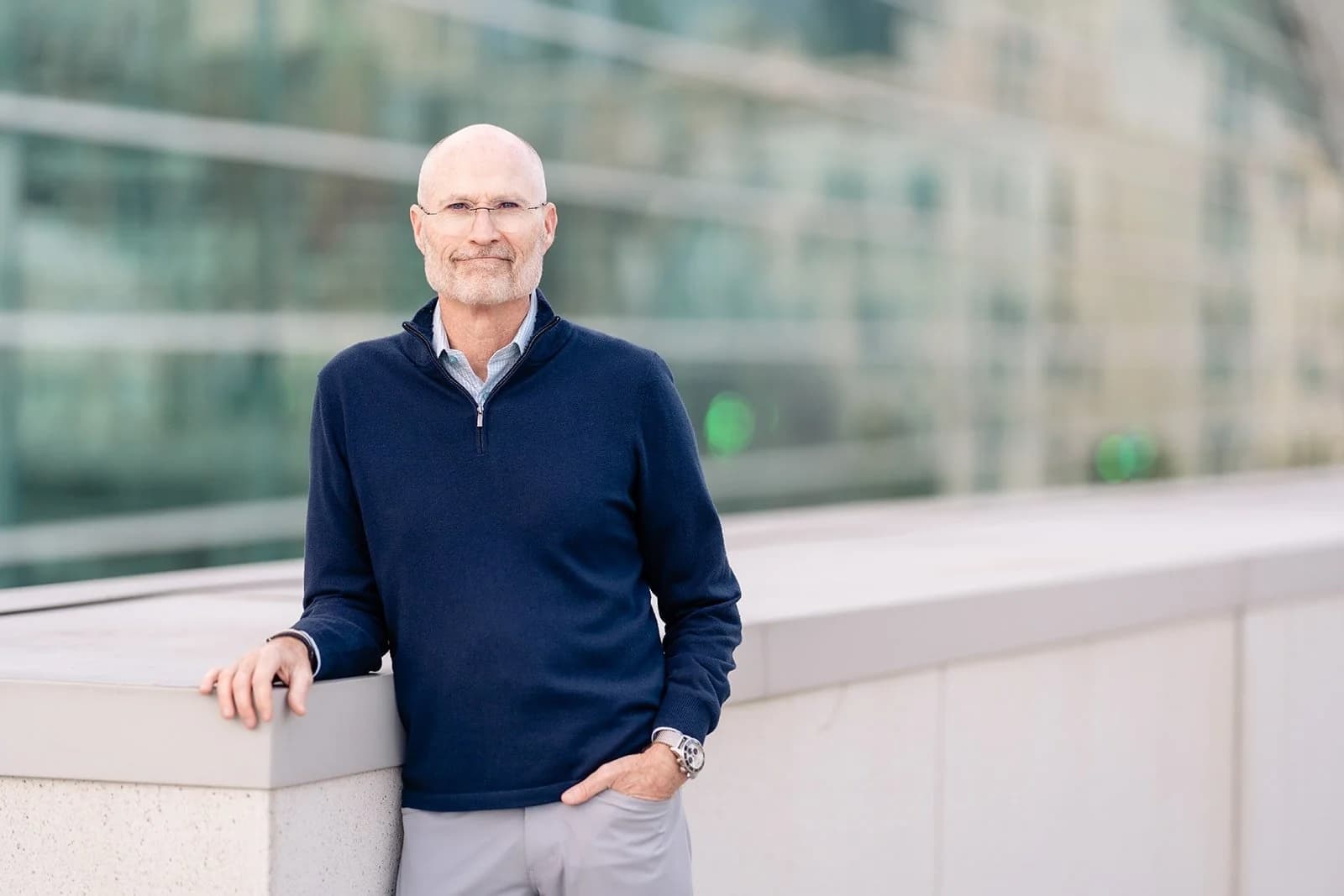 Kirk Michie, founder of ExitWell, photographed outside a modern glass office building